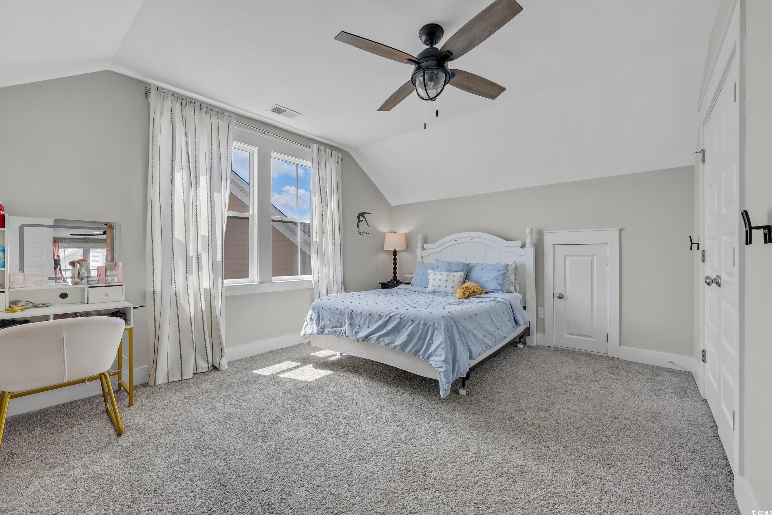 3005 Purity Place Loop Murrells Inlet, SC 29576 - Photo 27 of 36 Bedroom with lofted ceiling, carpet floors, and a