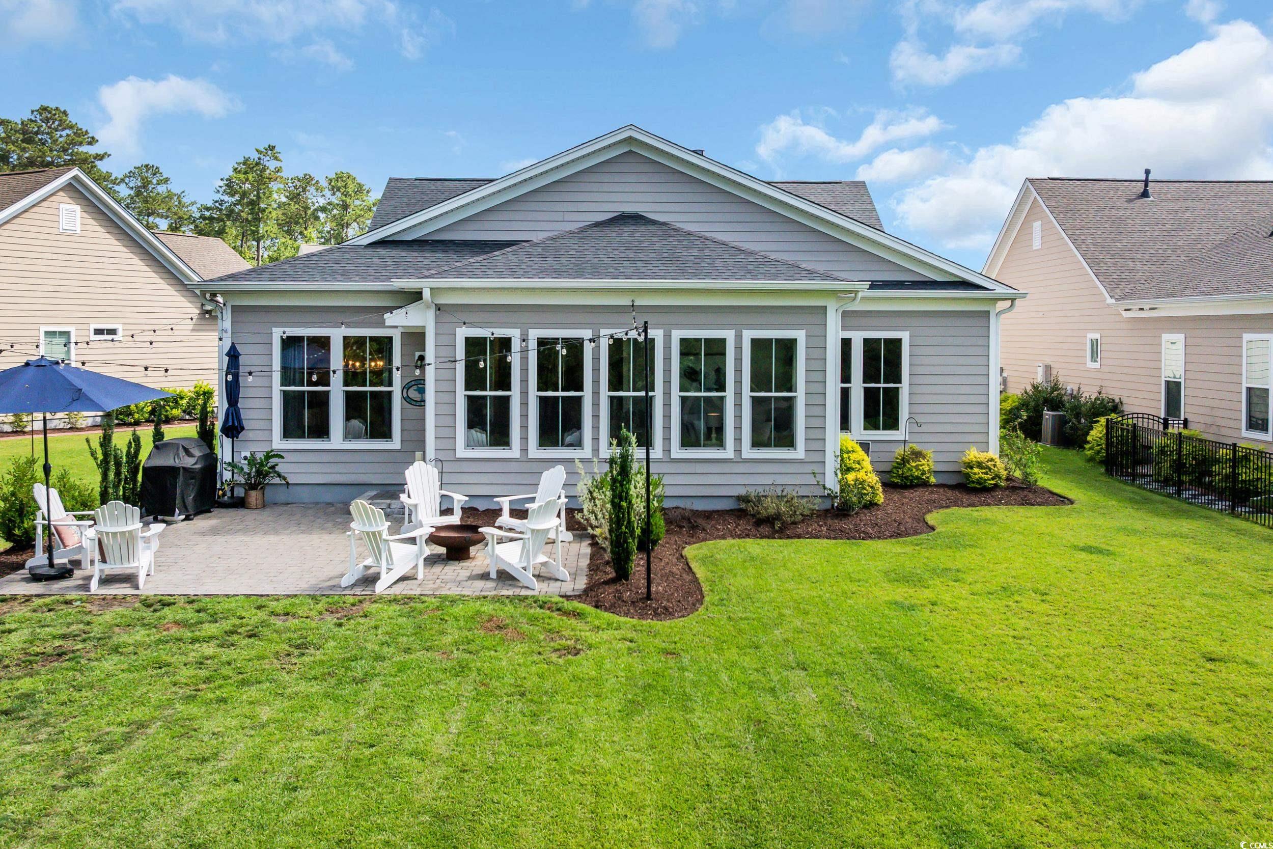 3005 Purity Place Loop Murrells Inlet, SC 29576 - Photo 28 of 36 Back of property featuring a patio, a shingled roo
