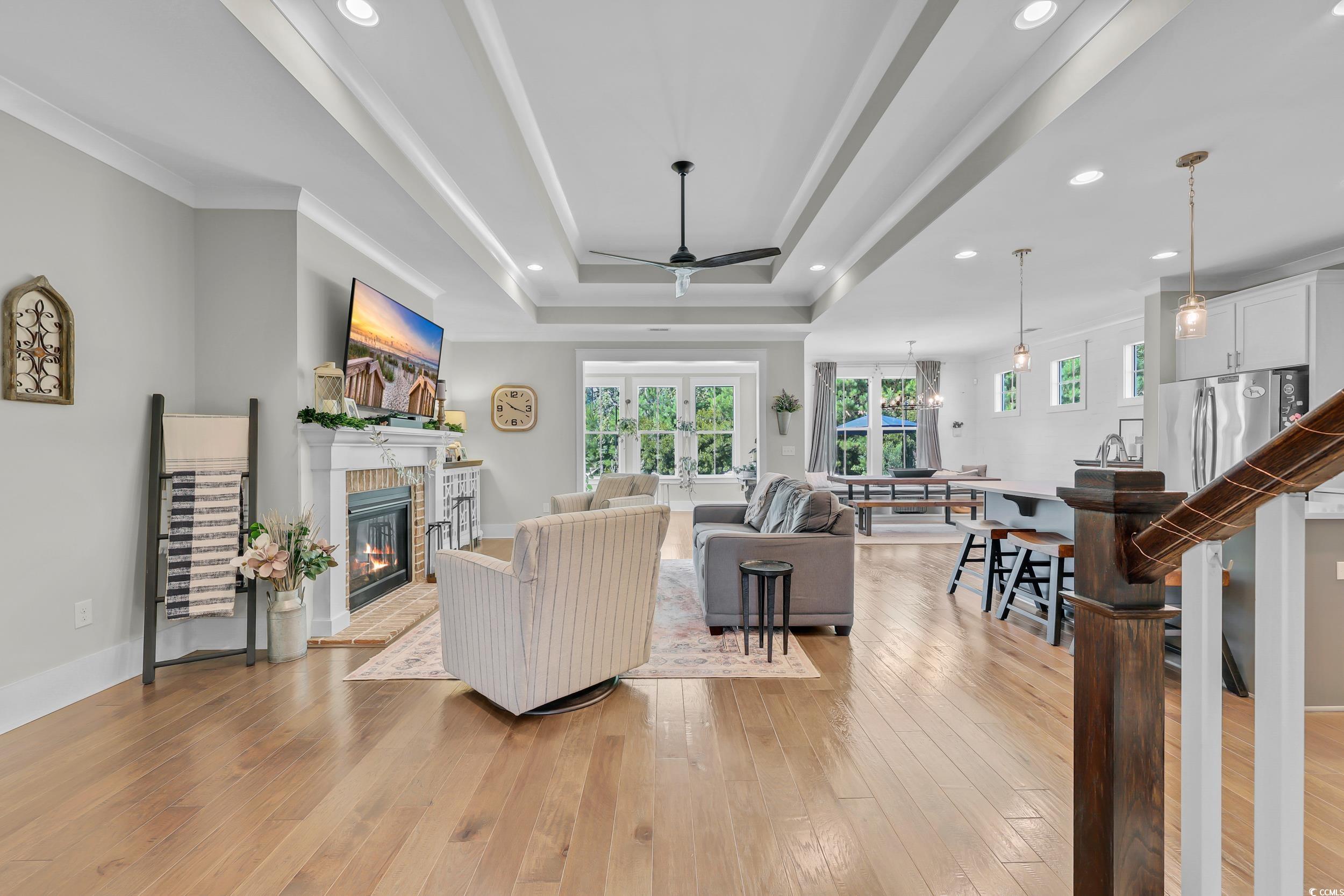 3005 Purity Place Loop Murrells Inlet, SC 29576 - Photo 3 of 36 Living area featuring a ceiling fan, a fireplace,