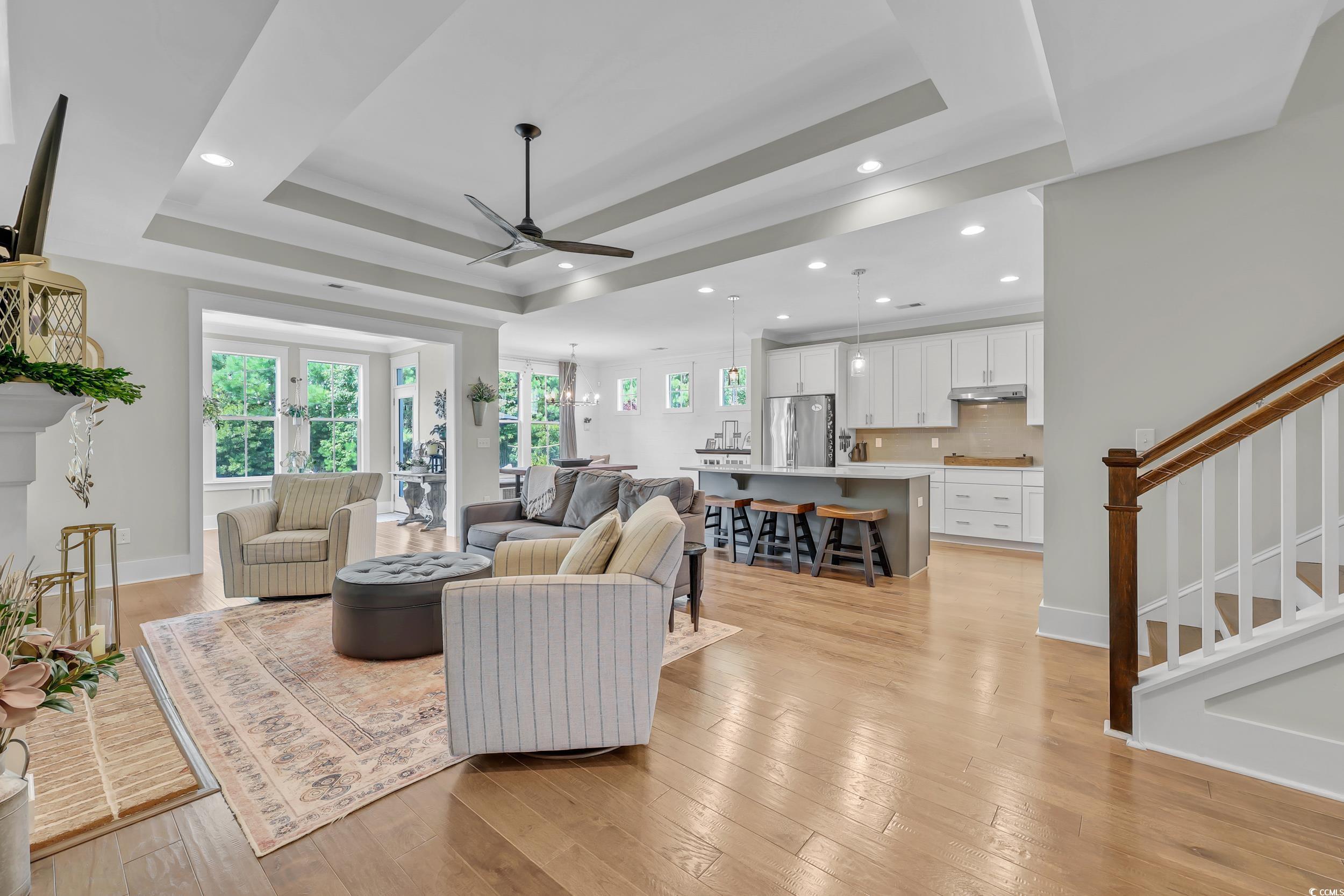 3005 Purity Place Loop Murrells Inlet, SC 29576 - Photo 4 of 36 Living area featuring a tray ceiling, ceiling fan,