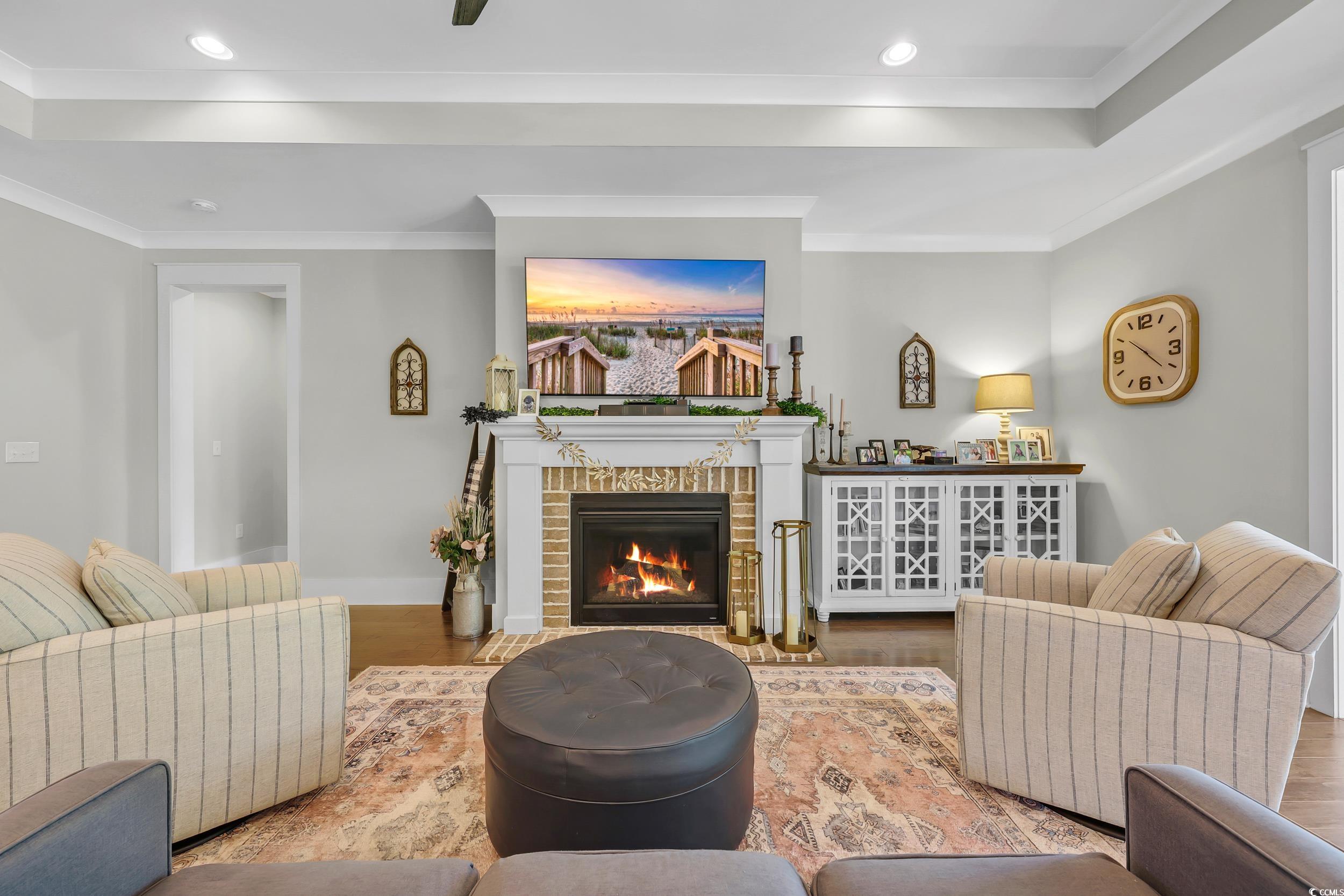 3005 Purity Place Loop Murrells Inlet, SC 29576 - Photo 6 of 36 Living area featuring wood finished floors, a fire