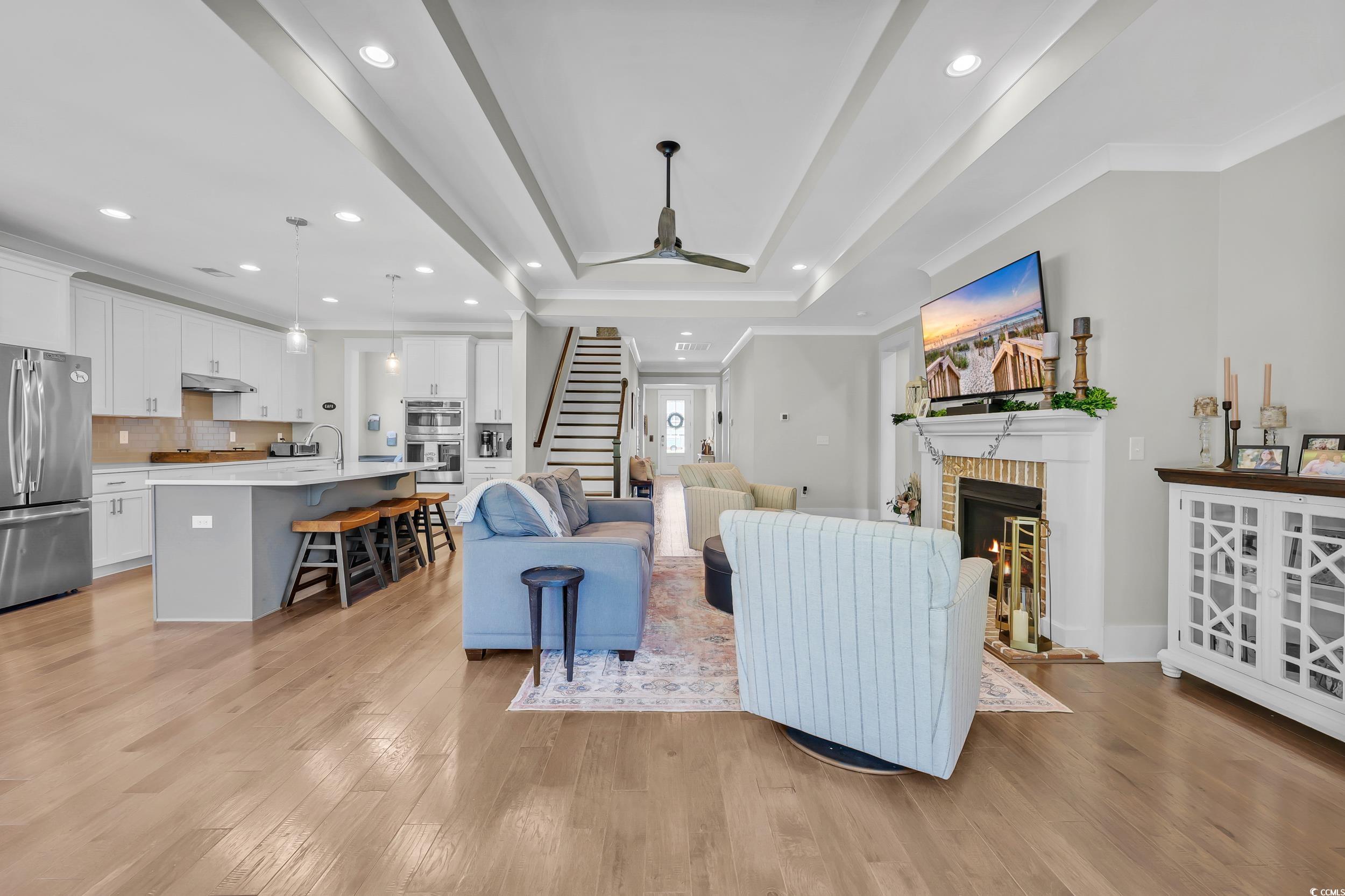 3005 Purity Place Loop Murrells Inlet, SC 29576 - Photo 7 of 36 Living room featuring stairs, a brick fireplace, l