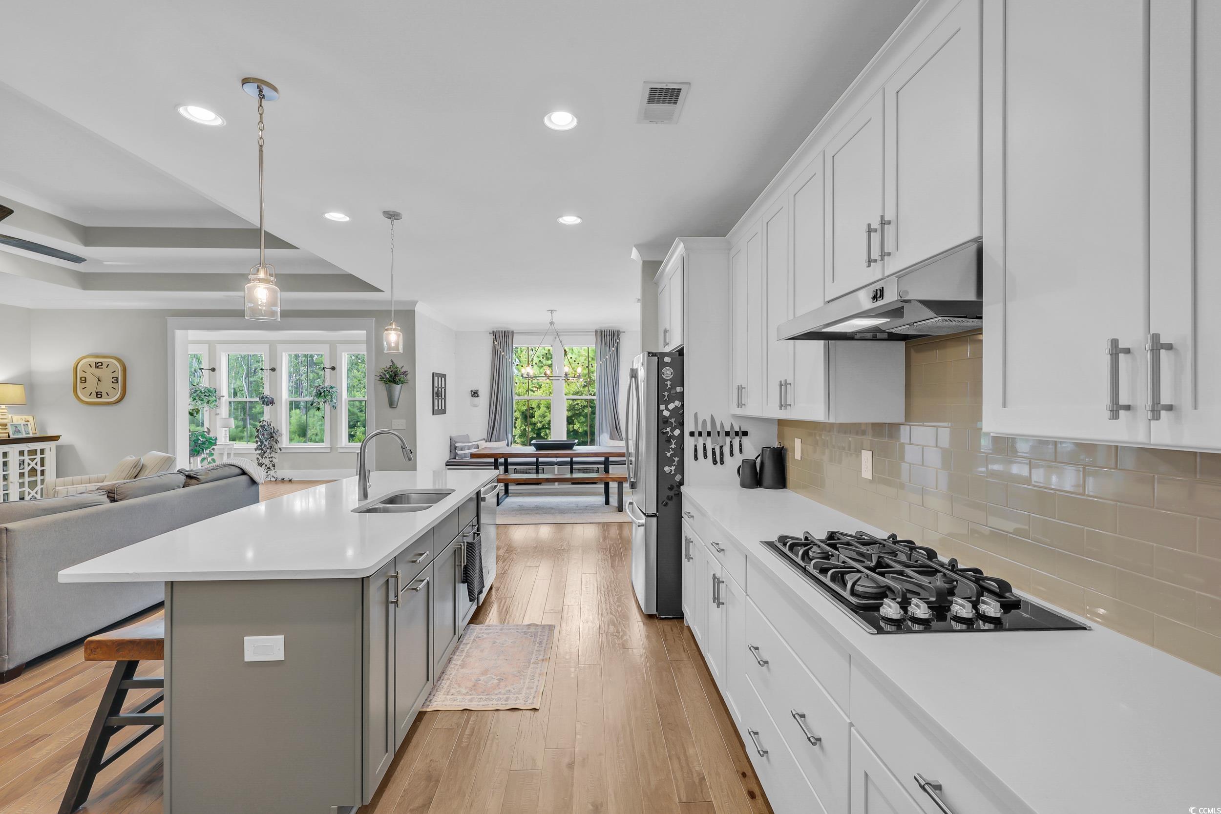 3005 Purity Place Loop Murrells Inlet, SC 29576 - Photo 8 of 36 Kitchen featuring black cooktop, under cabinet ran