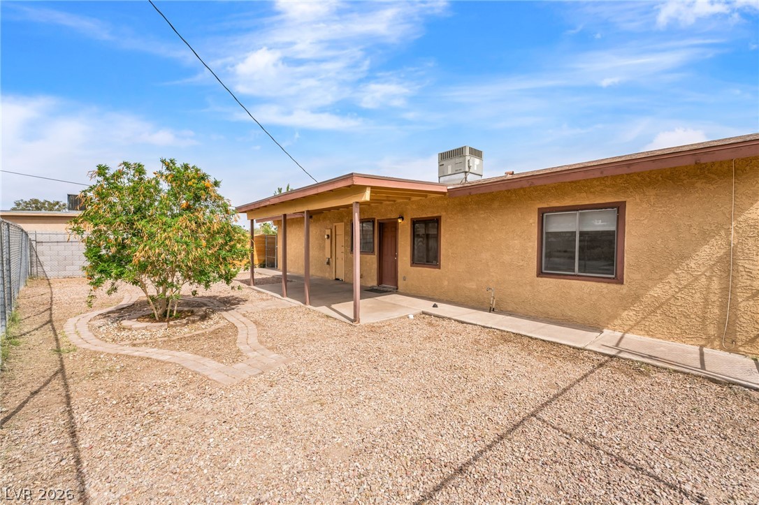 242 Nebraska Avenue Henderson, NV 89015 - Photo 27 of 46 Rear view of Unit A featuring a patio area, a fenced backyard.