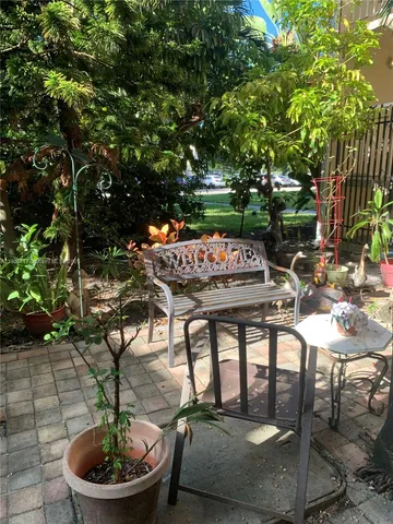 a table and chairs in a patio