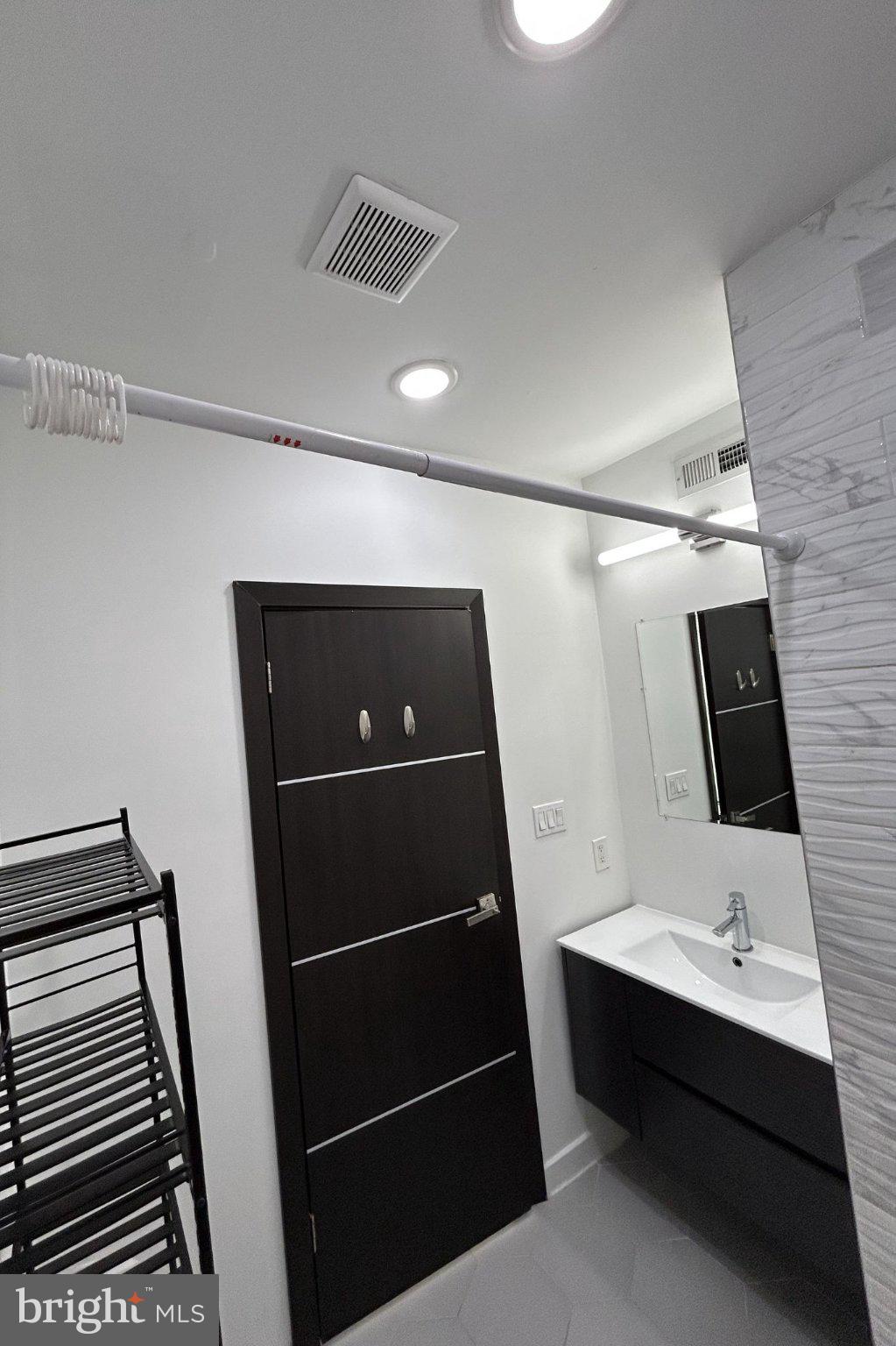 1713 South 2nd Street, Unit B Philadelphia, PA 19148 - Photo 6 of 15 Sleek modern bathroom with stylish accents.