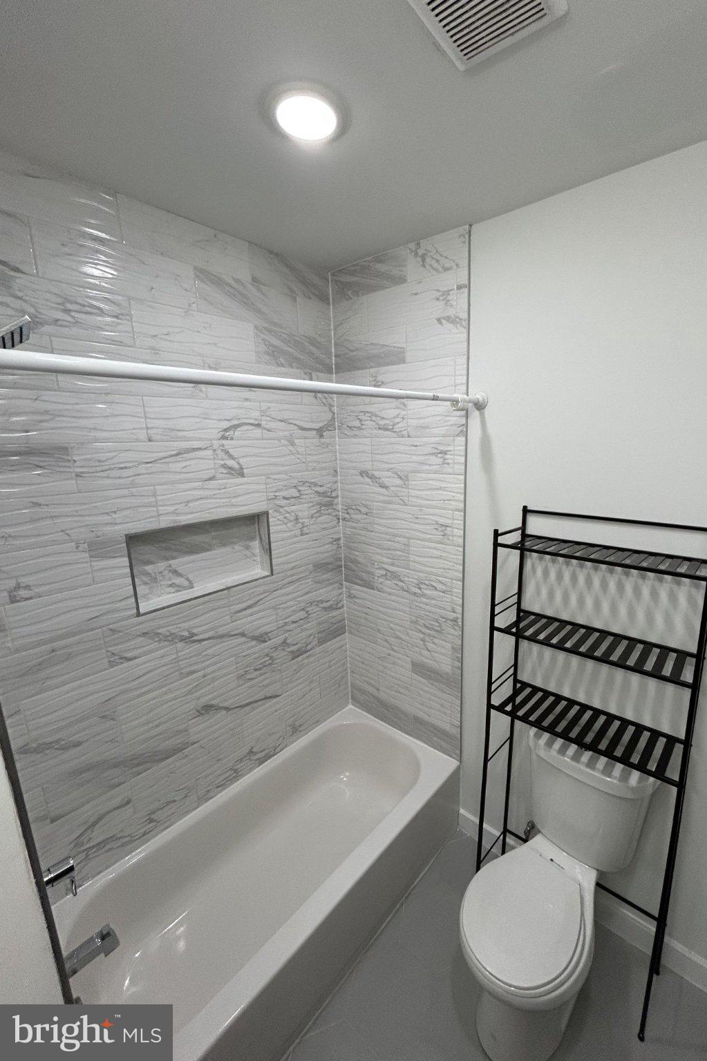 1713 South 2nd Street, Unit B Philadelphia, PA 19148 - Photo 7 of 15 Sleek modern bathroom with elegant tiles.