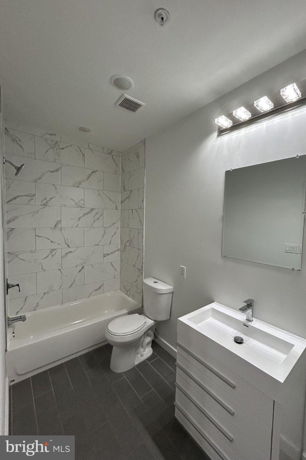 1713 South 2nd Street, Unit B Philadelphia, PA 19148 - Photo 9 of 15 Sleek modern bathroom with elegant tiles.
