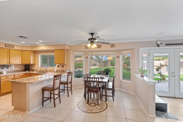a view of a dining room with furniture large windows and wooden floor