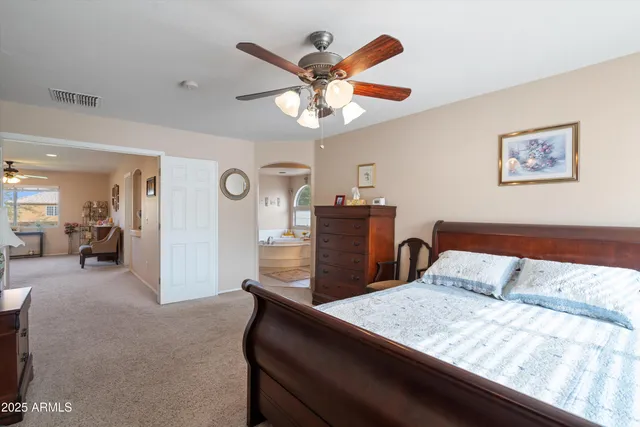a bathroom with a tub a sink and a shower