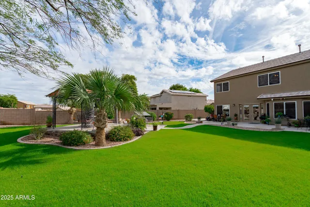 a view of a patio with a table and chairs