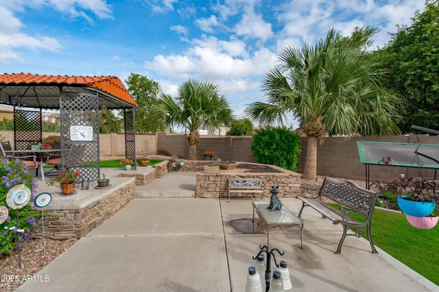 a view of a house with a yard porch and sitting area