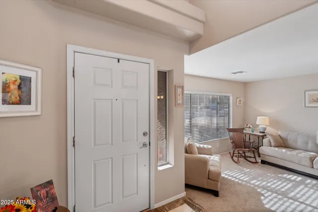 a living room with furniture and a window
