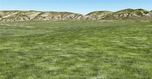 a view of a mountain with an ocean beach