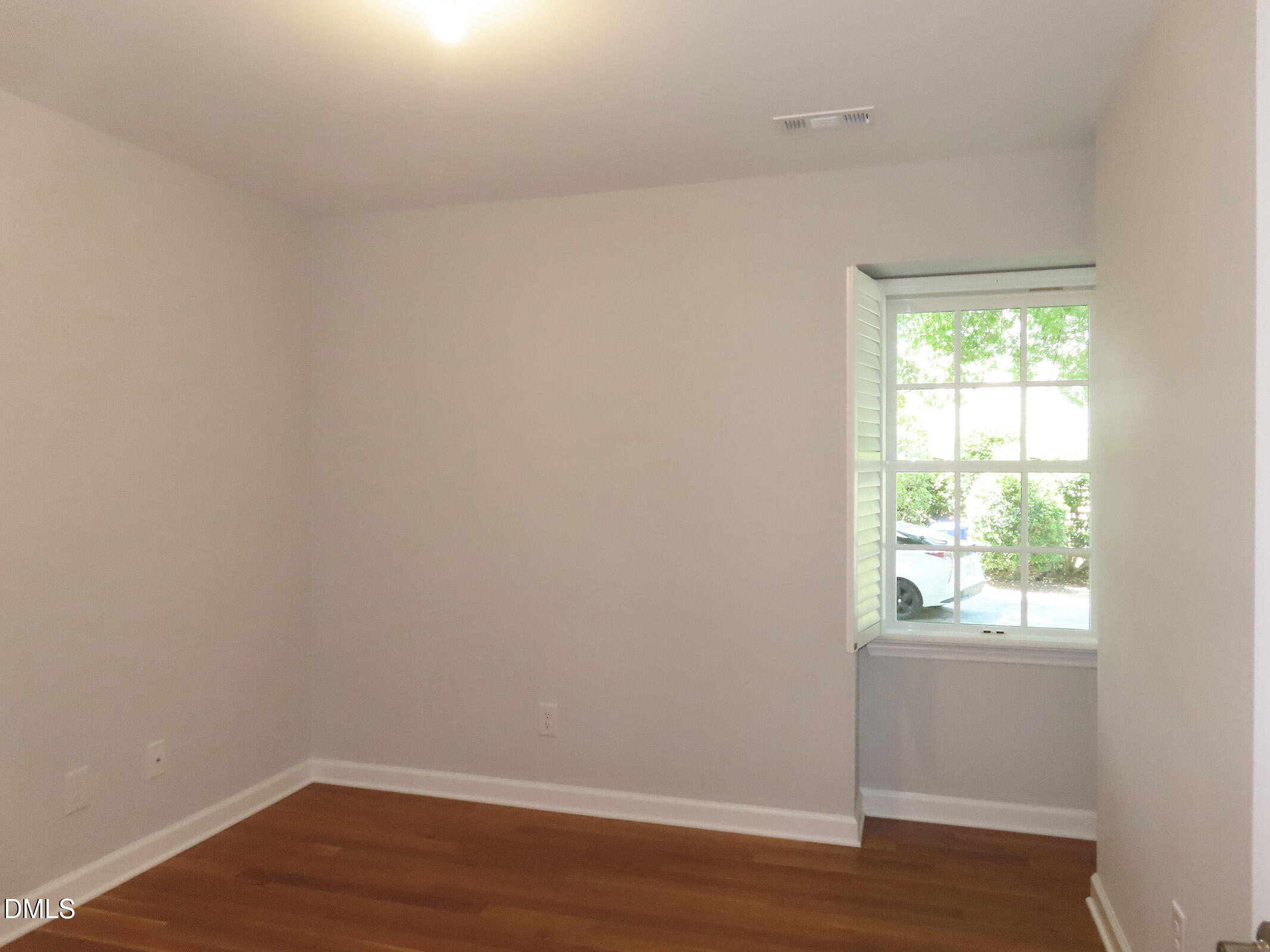 120 Weatherhill Point Carrboro, NC 27510 - Photo 12 of 25 a view of an empty room with wooden floor and a window