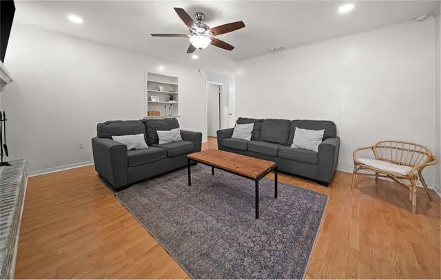 a living room with furniture and a rug