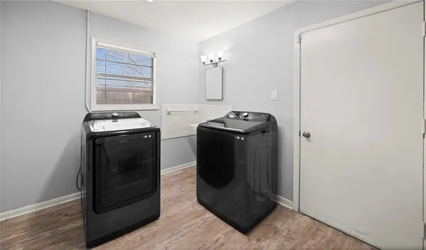 a utility room with washer and dryer