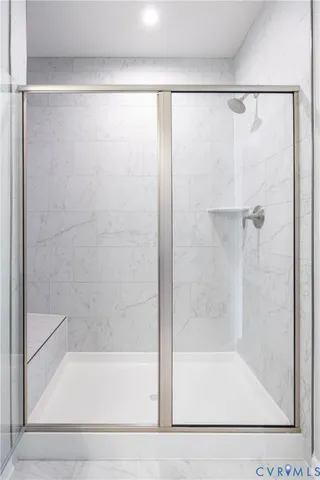 a bathroom with a shower and a bathtub