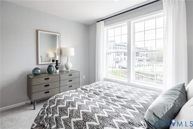 a bed room with a bed and a window