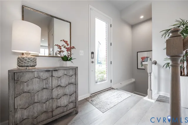 a bathroom with a granite countertop sink a mirror and a shower