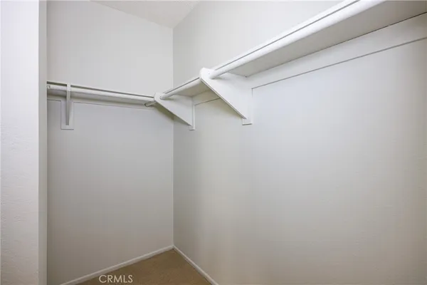 a view of an empty walk in closet