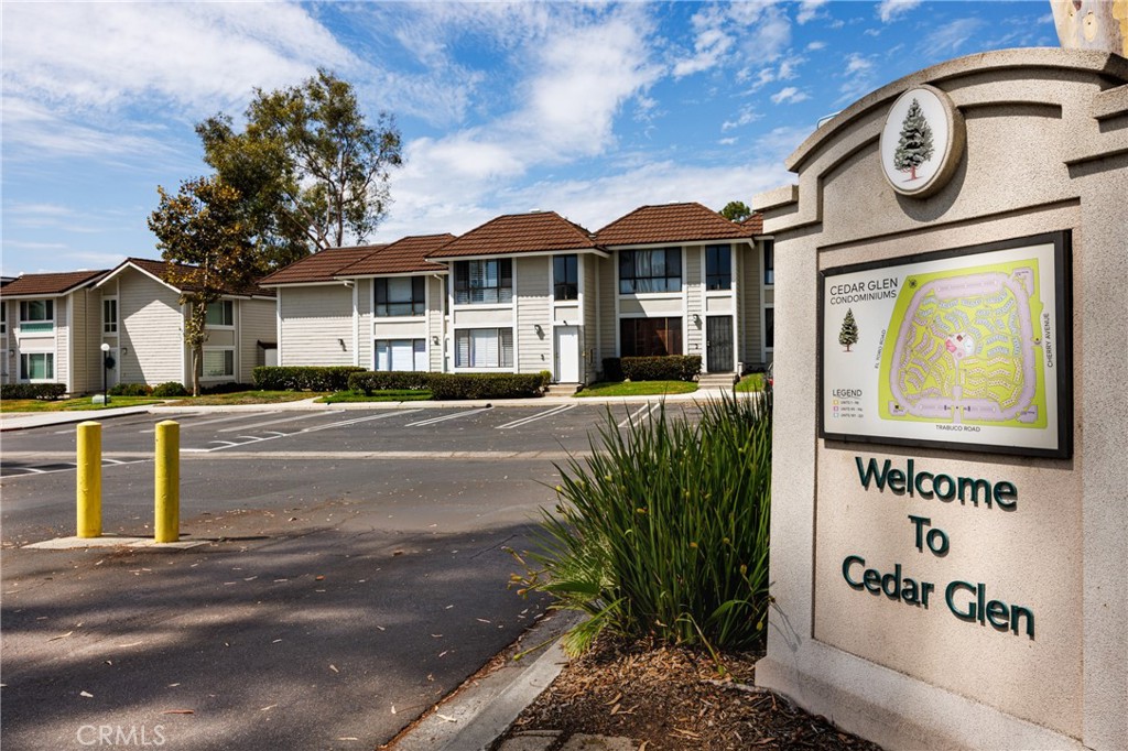 25885 Trabuco Road, Unit 206 Lake Forest, CA 92630 - Photo 2 of 40 a front view of a house with a garden and plants
