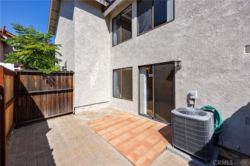 25885 Trabuco Road, Unit 206 Lake Forest, CA 92630 - Photo 25 of 40 a bedroom with a bed and a potted plant