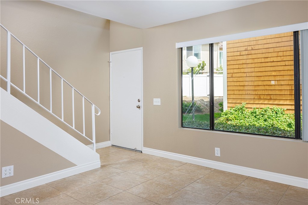25885 Trabuco Road, Unit 206 Lake Forest, CA 92630 - Photo 4 of 40 a view of an entryway with wooden floor
