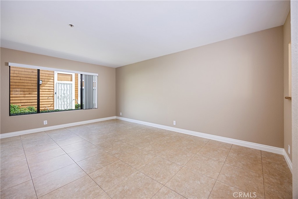 25885 Trabuco Road, Unit 206 Lake Forest, CA 92630 - Photo 6 of 40 a view of an empty room with a window