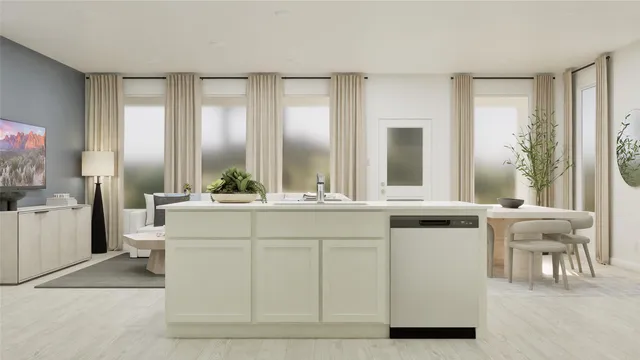 a kitchen with white cabinets and sink