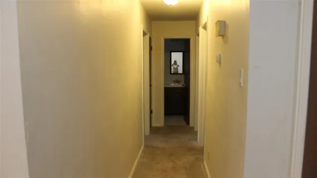 a white toilet sitting next to a window