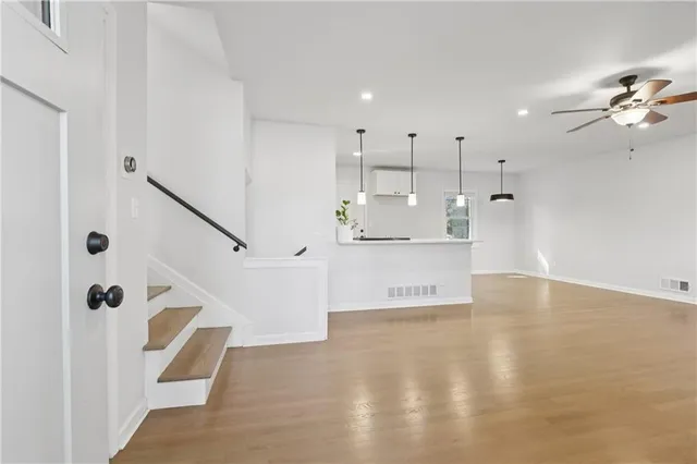 a view of a kitchen with a sink and cabinet with living room view