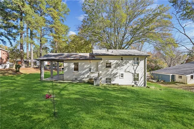 a view of a table and chairs under an umbrella