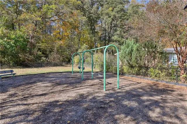 a view of a balcony with two chairs and a table
