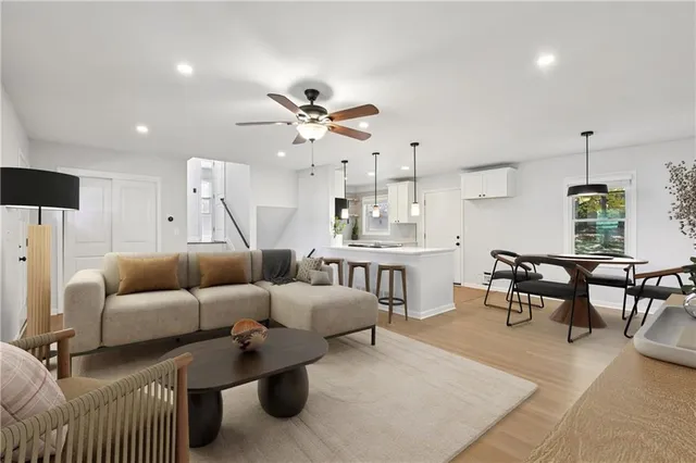 a living room with furniture and a large window