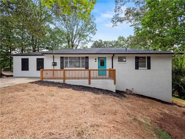a house with trees in the background