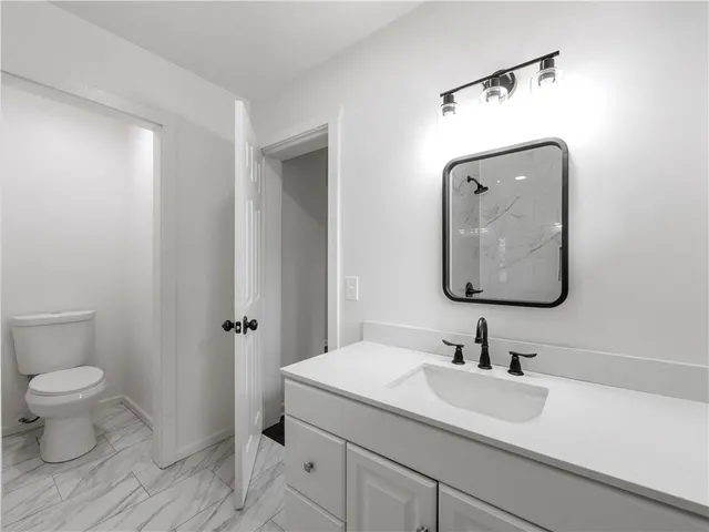 a view of staircase with white walls