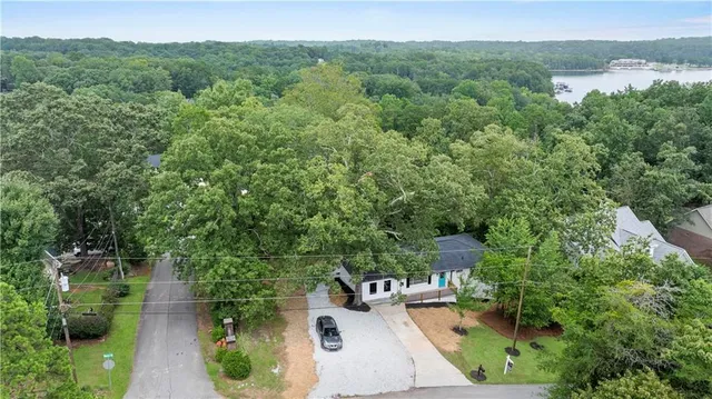 an aerial view of a house with a yard