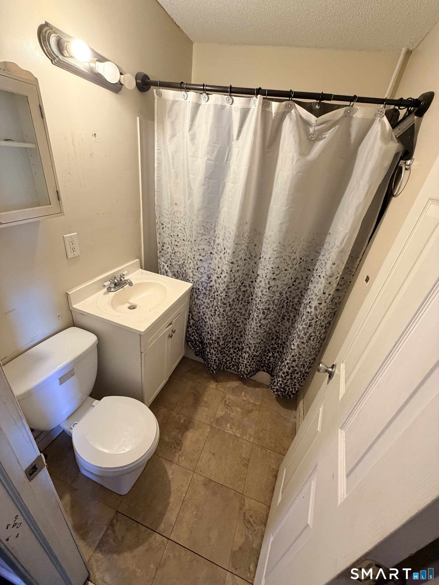 51 Seyms Street, Unit 2 Hartford, CT 06120 - Photo 4 of 13 a bathroom with a sink a toilet a mirror and shower