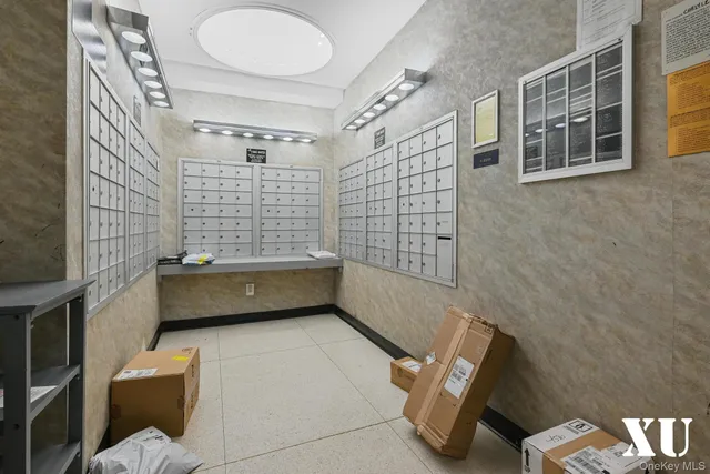 a living room with furniture and view of kitchen