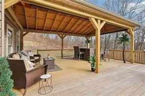 a view of a patio with table and chairs