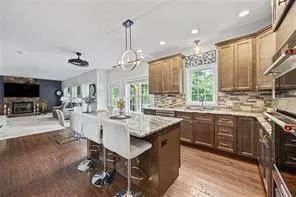 a large kitchen with lots of counter space and chandelier