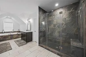 a bathroom with a mirror a bathtub and a shower