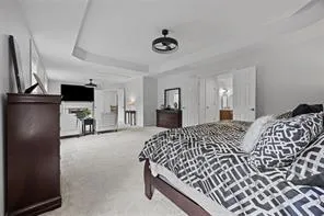 a bedroom with double bed and a flat tv screen