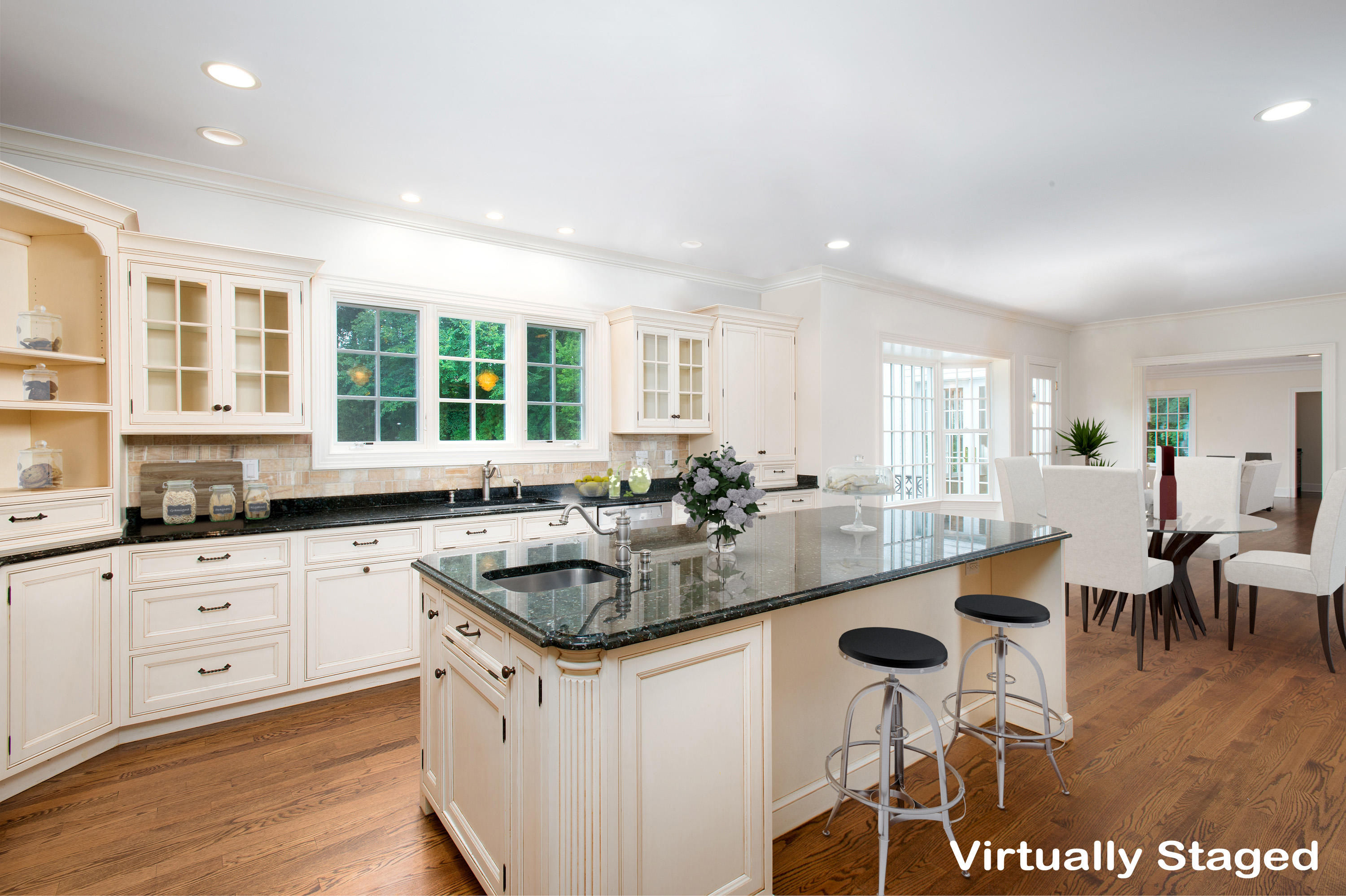 399 Wahackme Road New Canaan, CT 06840 - Photo 12 of 35 a kitchen with center island table and chairs