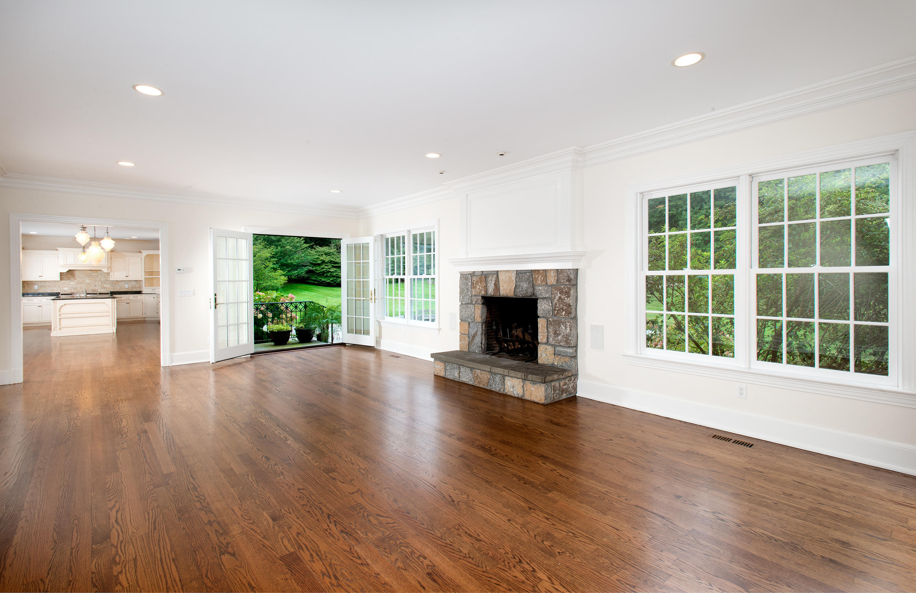 399 Wahackme Road New Canaan, CT 06840 - Photo 15 of 35 a view of empty room with wooden floor and fireplace