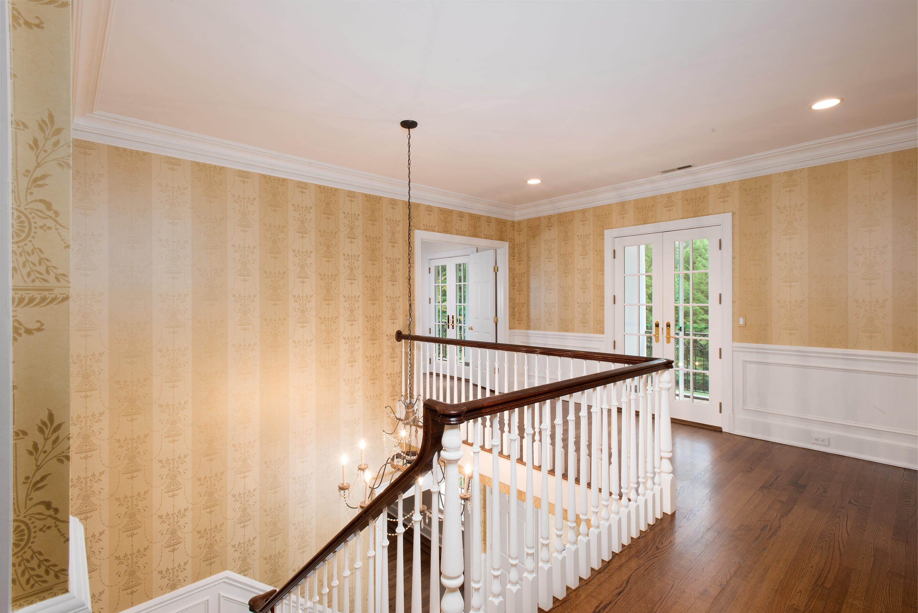 399 Wahackme Road New Canaan, CT 06840 - Photo 16 of 35 a view of a room with wooden floor and stairs