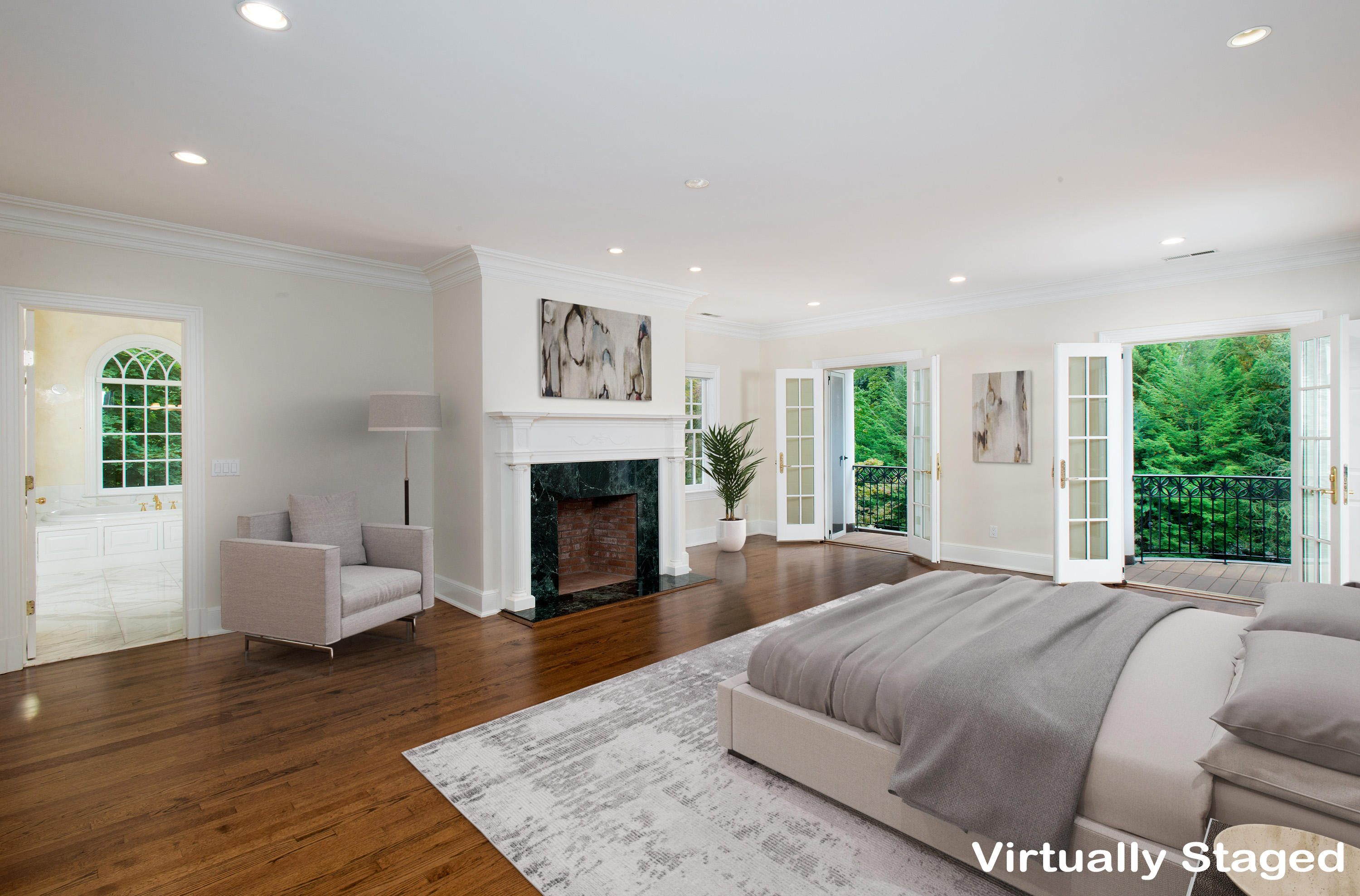 399 Wahackme Road New Canaan, CT 06840 - Photo 17 of 35 a spacious bedroom with a bed and a fireplace