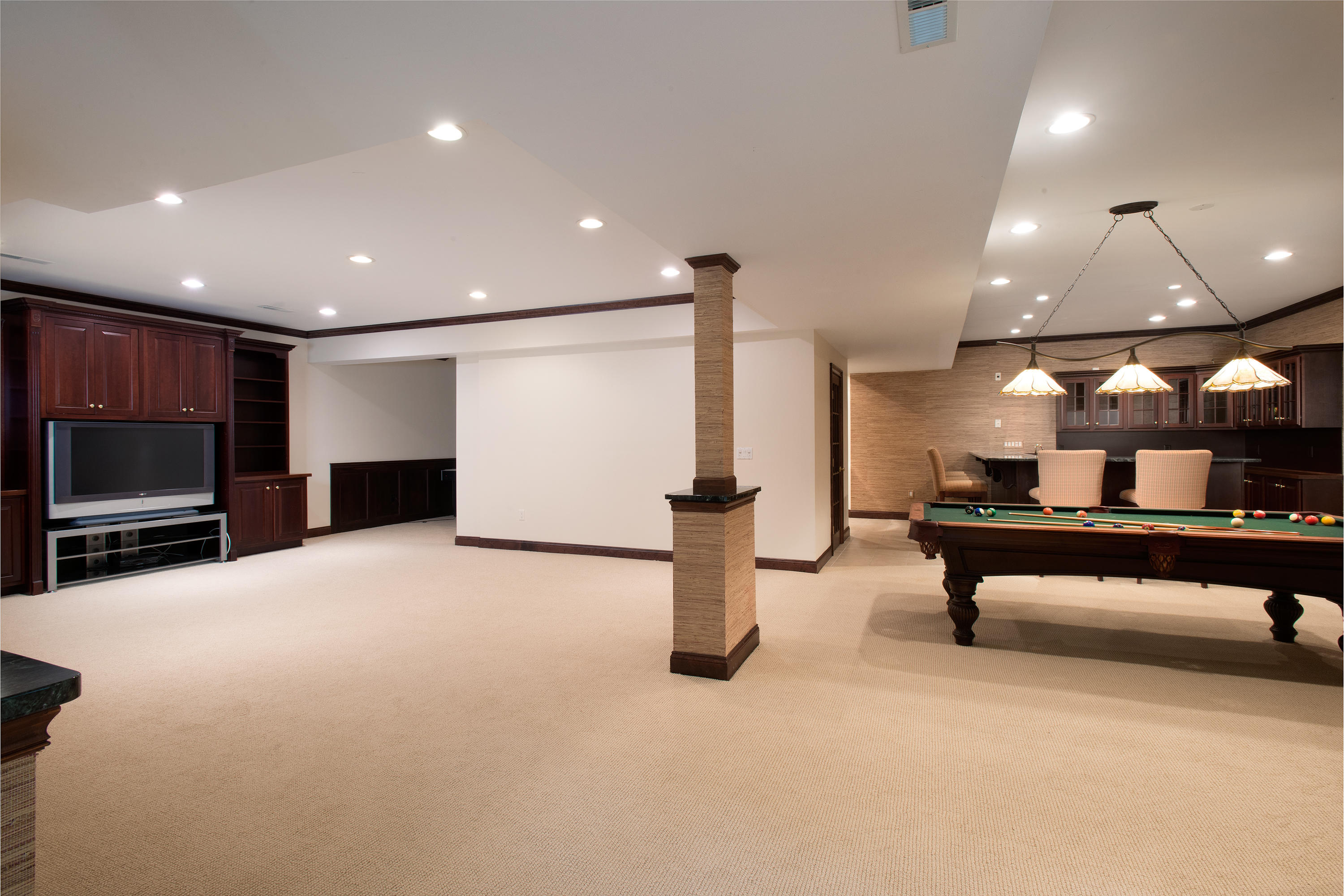 399 Wahackme Road New Canaan, CT 06840 - Photo 22 of 35 a room with lots of furniture and a flat screen tv