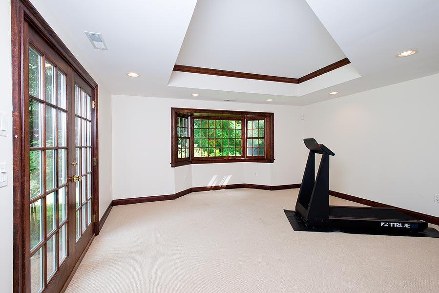 399 Wahackme Road New Canaan, CT 06840 - Photo 24 of 35 a view of a hallway with a window